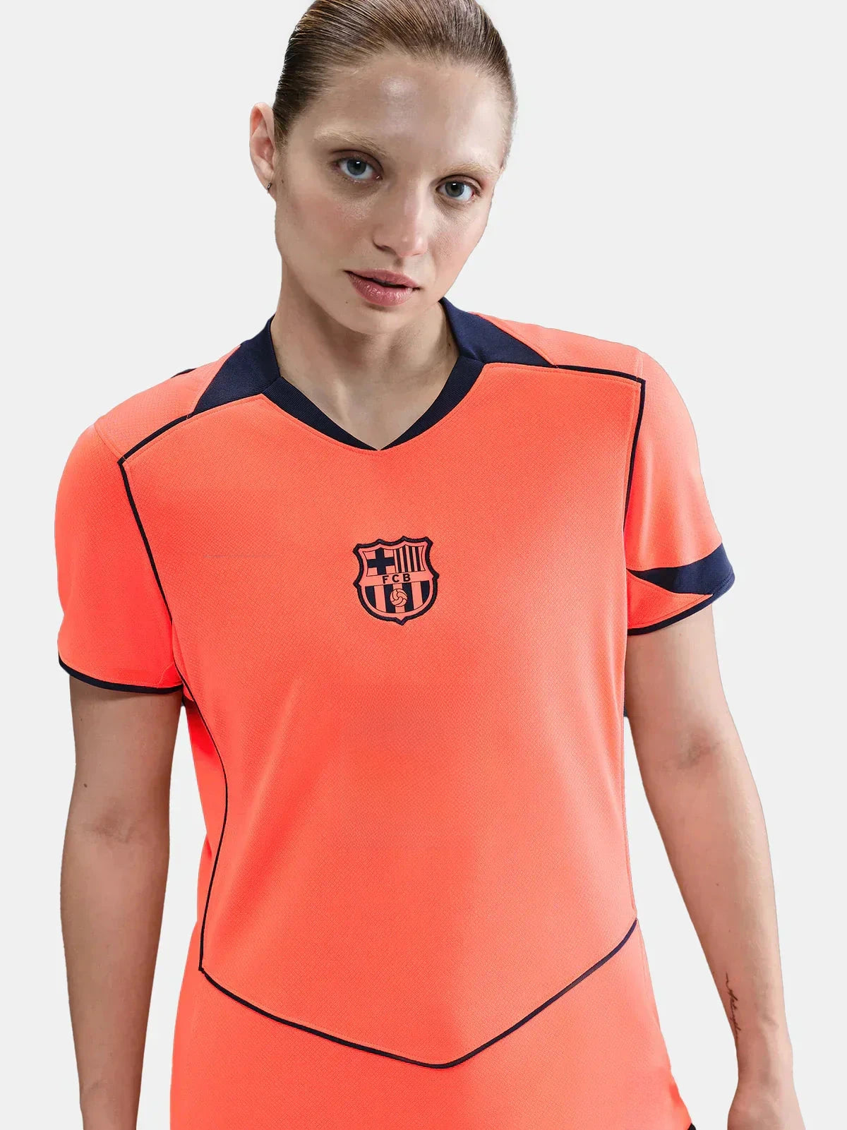 Femenina Barcelona 25/26 third jersey, bright orange with FC Barcelona crest, Spotify logo